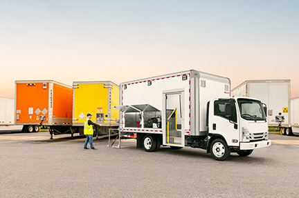 Mobile Service Unit truck body driving down the road