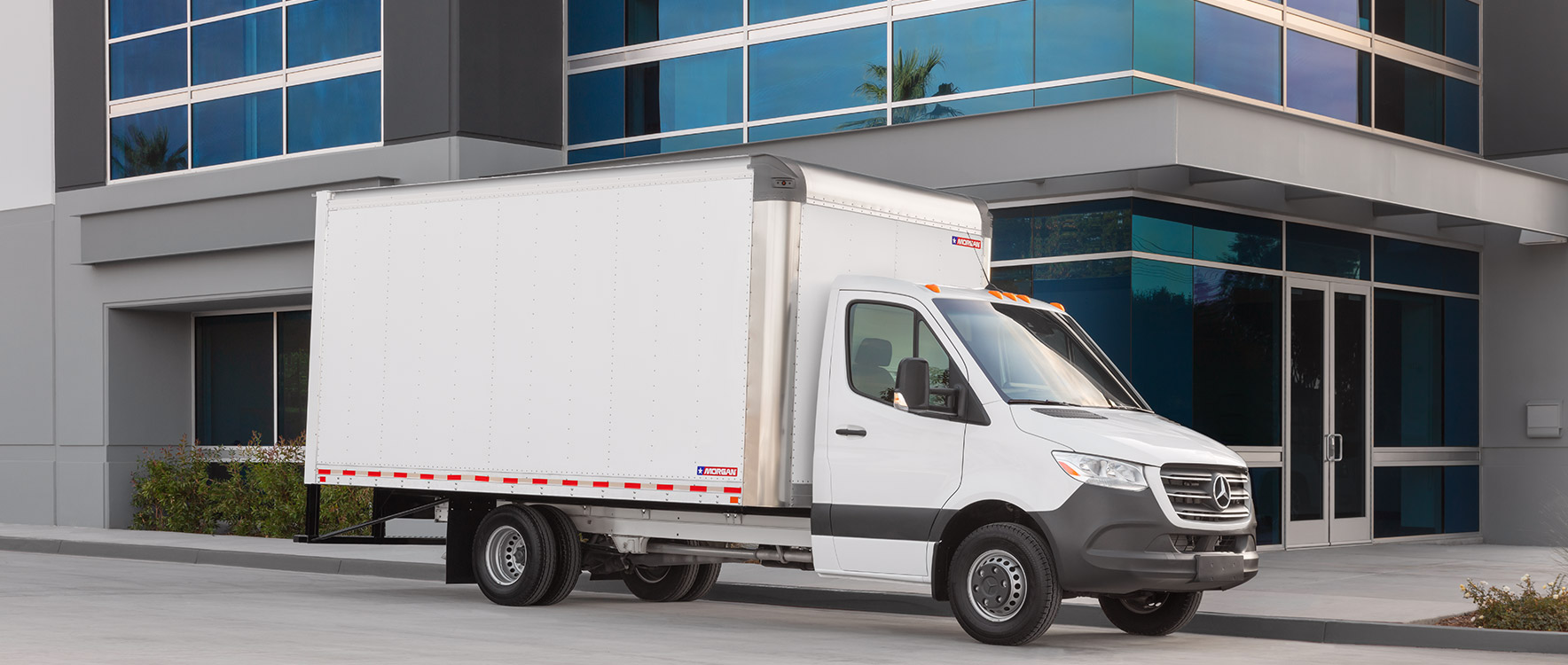 Gold Star dry freight truck stopped at corporate location for delivery