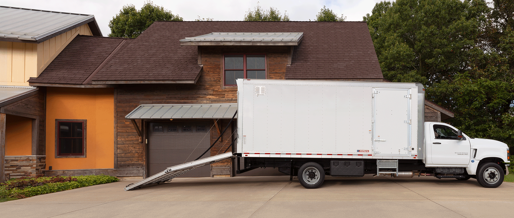Dry Freight Proscape-Van unloading items using ramp door