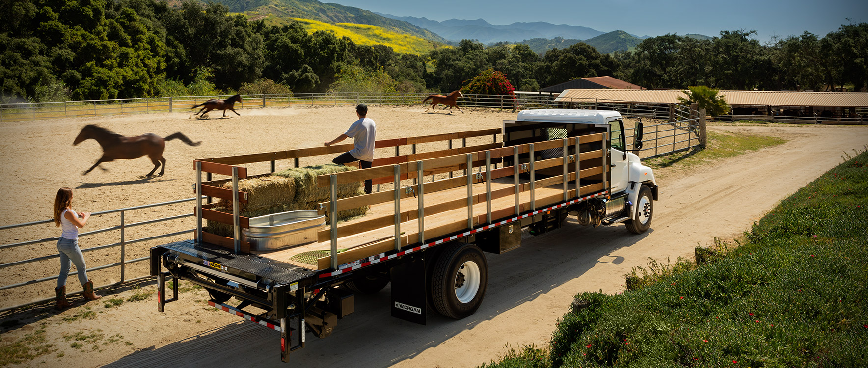 A Platform/Dump ProStake at a horse ranch being used drop off feed and water for the horses